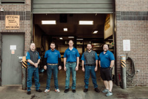 Andrew Otto and the Otto Service Team standing outside of Otto Service of Kansas City